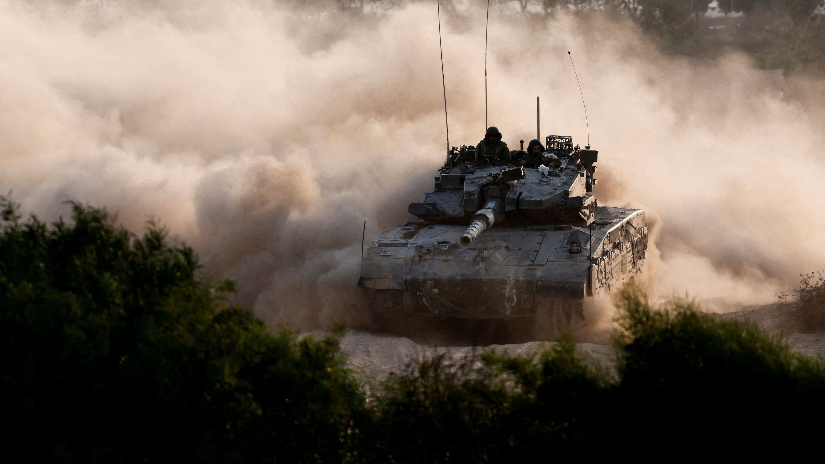 <div class="paragraphs"><p>An Israeli tank manoeuvres near the Israel-Gaza border, amid the ongoing conflict between Israel and Hamas.</p></div>