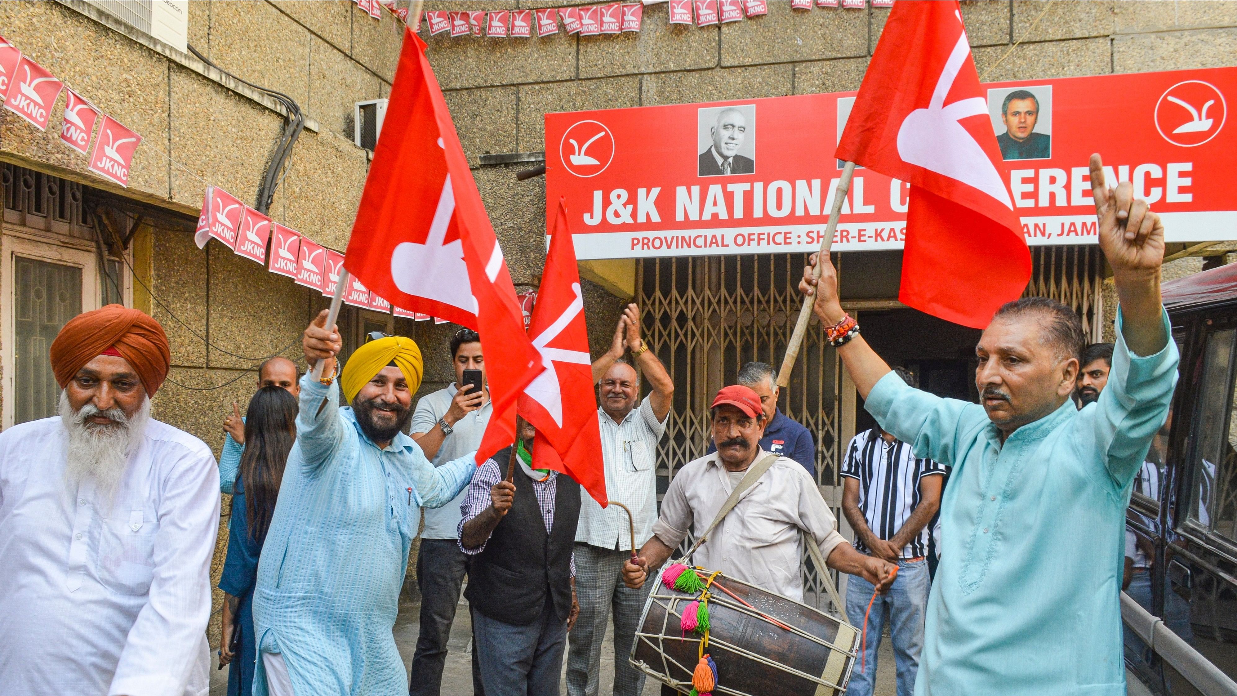 <div class="paragraphs"><p>National Conference workers celebrate at the party office after party  leader Omar Abdullah took oath as Jammu and Kashmir Chief Minister.</p></div>