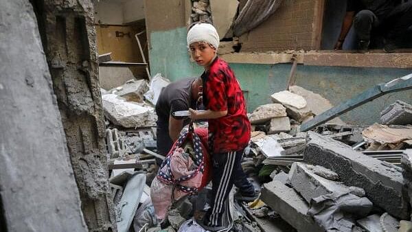 <div class="paragraphs"><p>Palestinians search for casualties stranded under the rubble of a house hit in an Israeli strike, amid the Israel-Hamas conflict, in Gaza City October 16, 2024.</p></div>