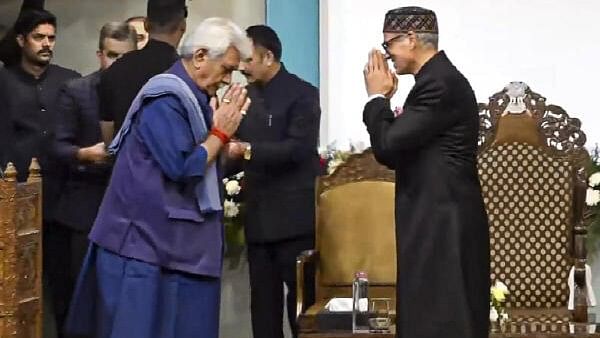 <div class="paragraphs"><p>Jammu and Kashmir Lieutenant Governor Manoj Sinha being greeted by CM-designate Omar Abdullah before the latter's swearing-in ceremony, in Srinagar, Wednesday, Oct 16, 2024.</p></div>