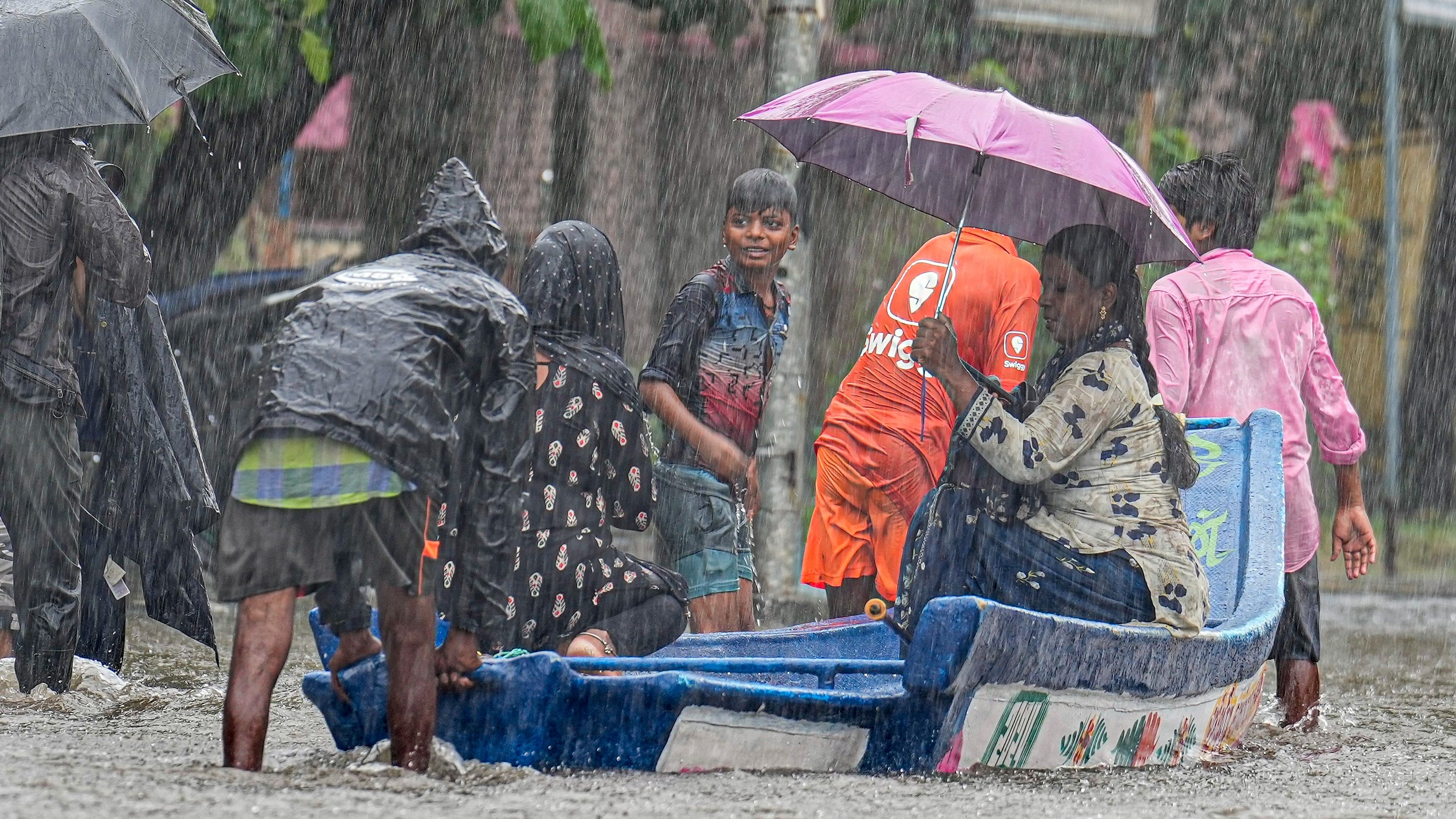 <div class="paragraphs"><p>People use a boat to go to a safer place amid rains in a waterlogged area, in Chennai, Wednesday, Oct. 16, 2024.</p></div>