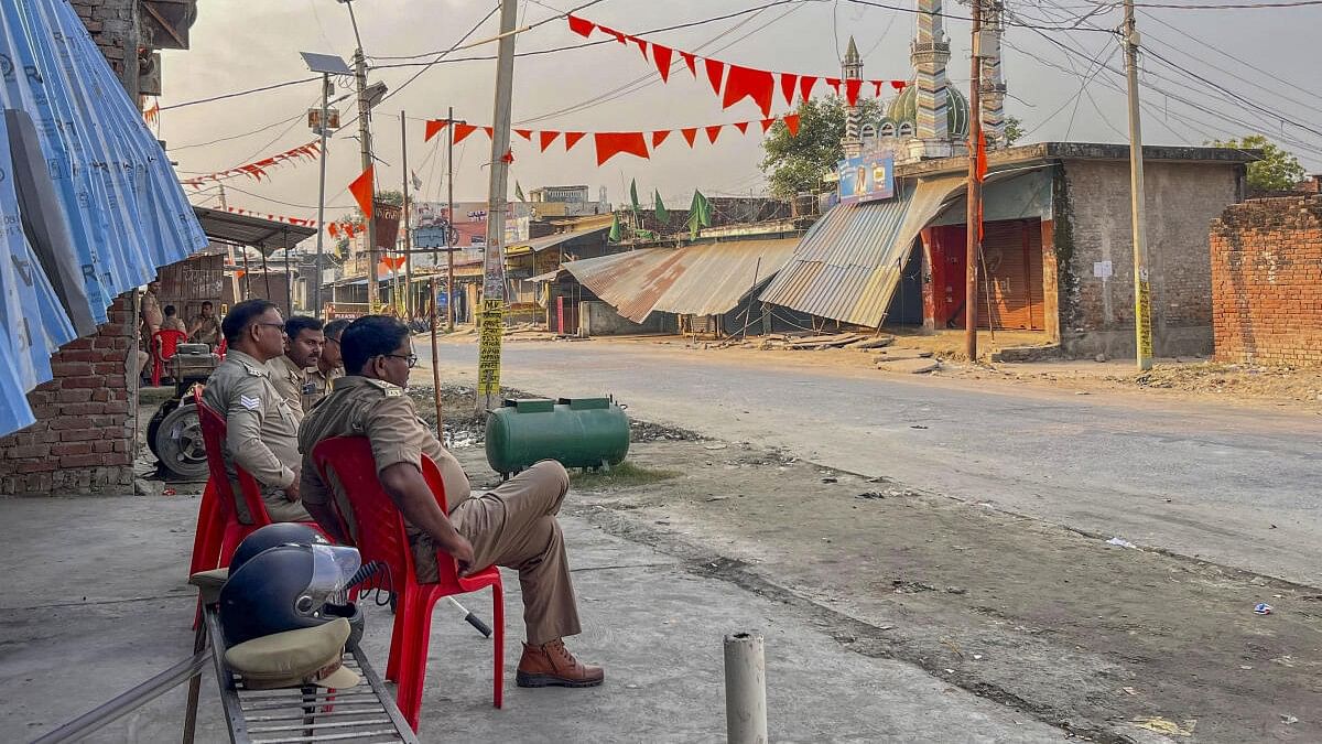 <div class="paragraphs"><p>Police personnel keep a vigil at a deserted area of Maharajganj after a recent communal violence, in Bahraich district.</p></div>