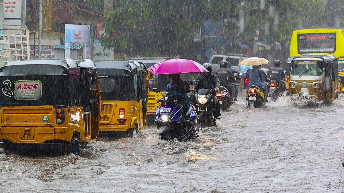 <div class="paragraphs"><p>Vehicles ply on a heavily waterlogged road amid rains, in Chennai.</p></div>