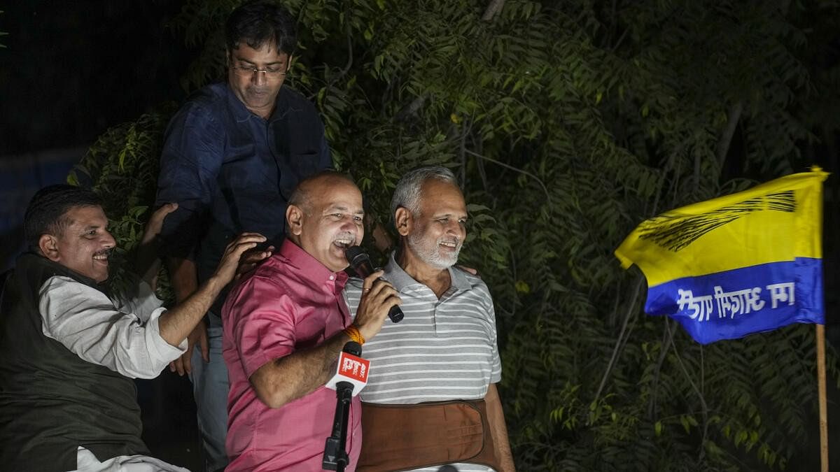 <div class="paragraphs"><p>AAP leader and former Delhi health minister Satyendar Jain with party leaders Manish Sisodia and Sanjay Singh greets supporters after being released from the Tihar Jail, in New Delhi, Friday, Oct. 18, 2024. </p></div>