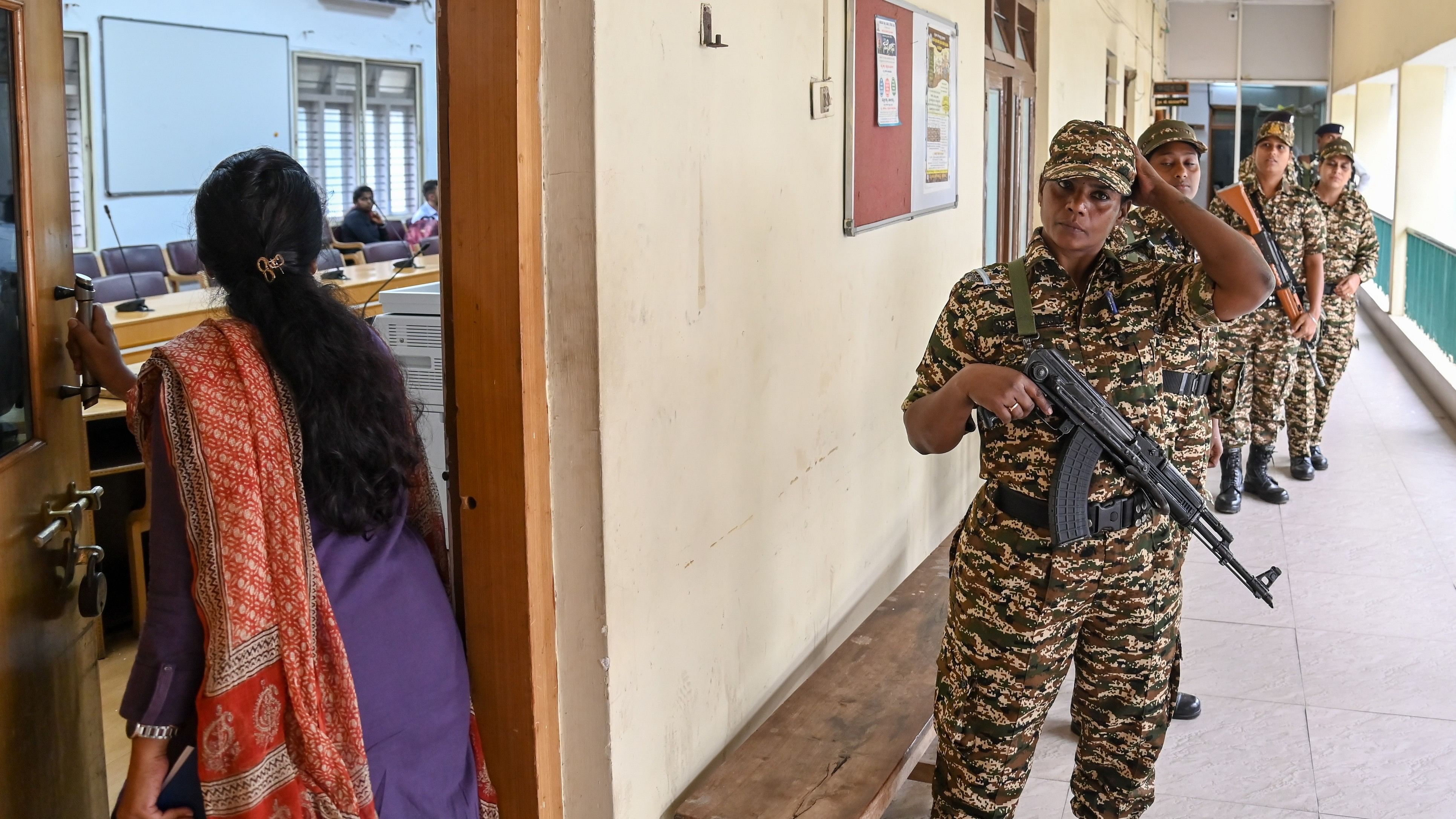 <div class="paragraphs"><p>CRPF personnel in the corridors of MUDA office in Mysuru, on Friday, as the officials inspect documents inside.</p></div>