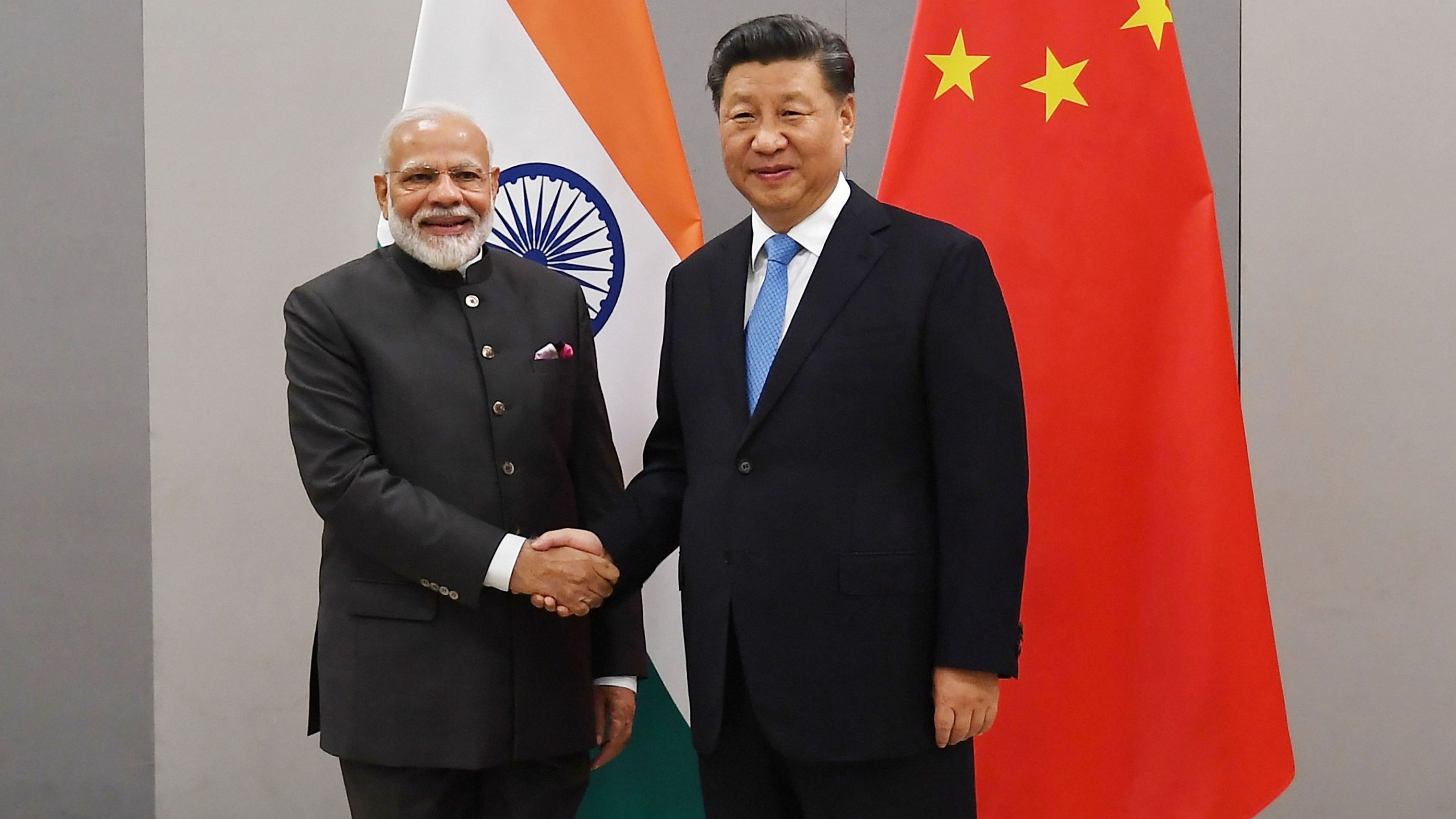 <div class="paragraphs"><p>Prime Minister Narendra Modi shakes hands with Chinese President Xi Jinping</p></div>