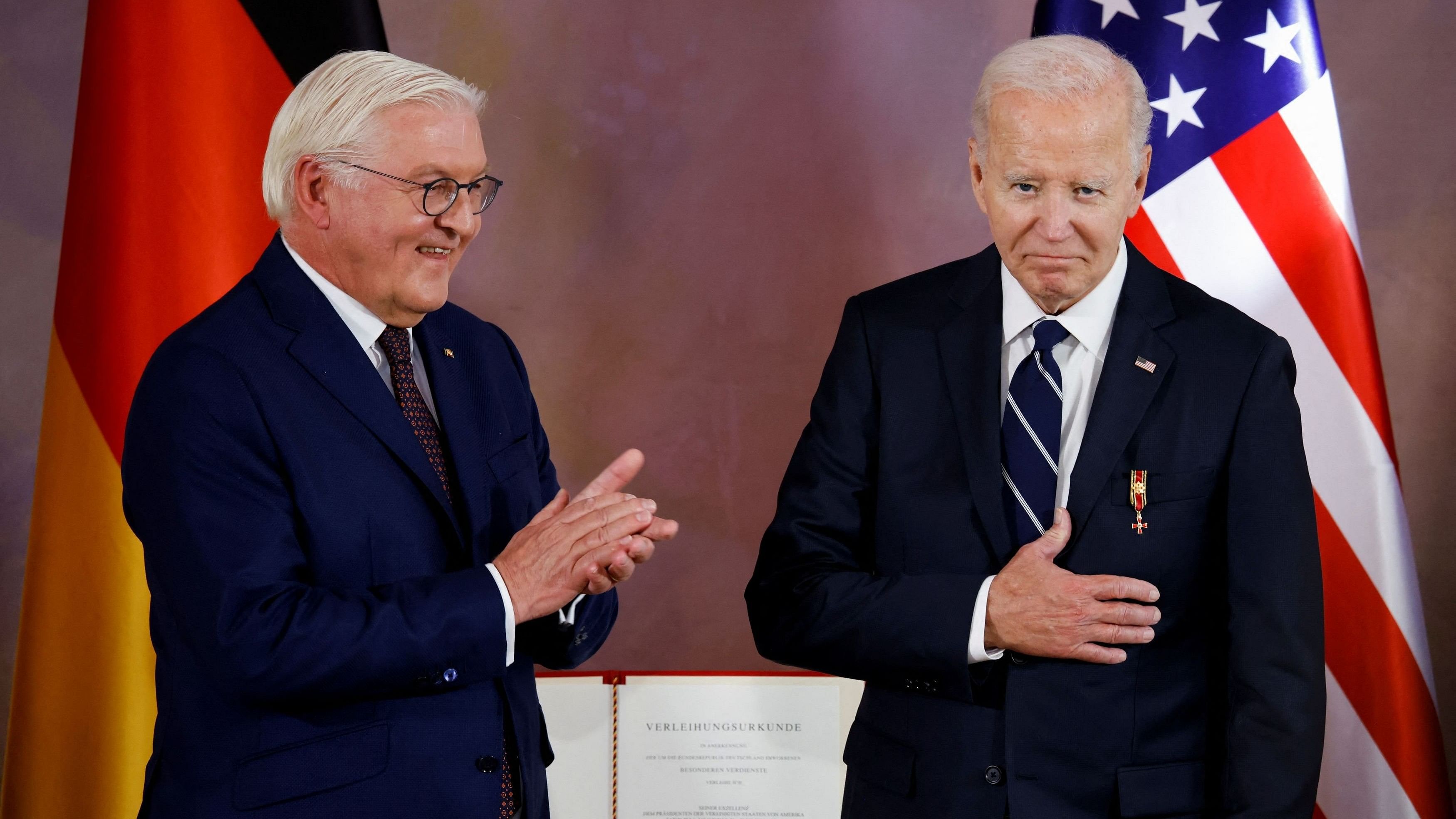 <div class="paragraphs"><p>US President Joe Biden reacts, as he is awarded Germany's highest honour, the Grand Cross of the Order of Merit for special achievements, by President Frank-Walter Steinmeier at a ceremony at Bellevue Palace in Berlin, Germany, October 18, 2024. </p></div>