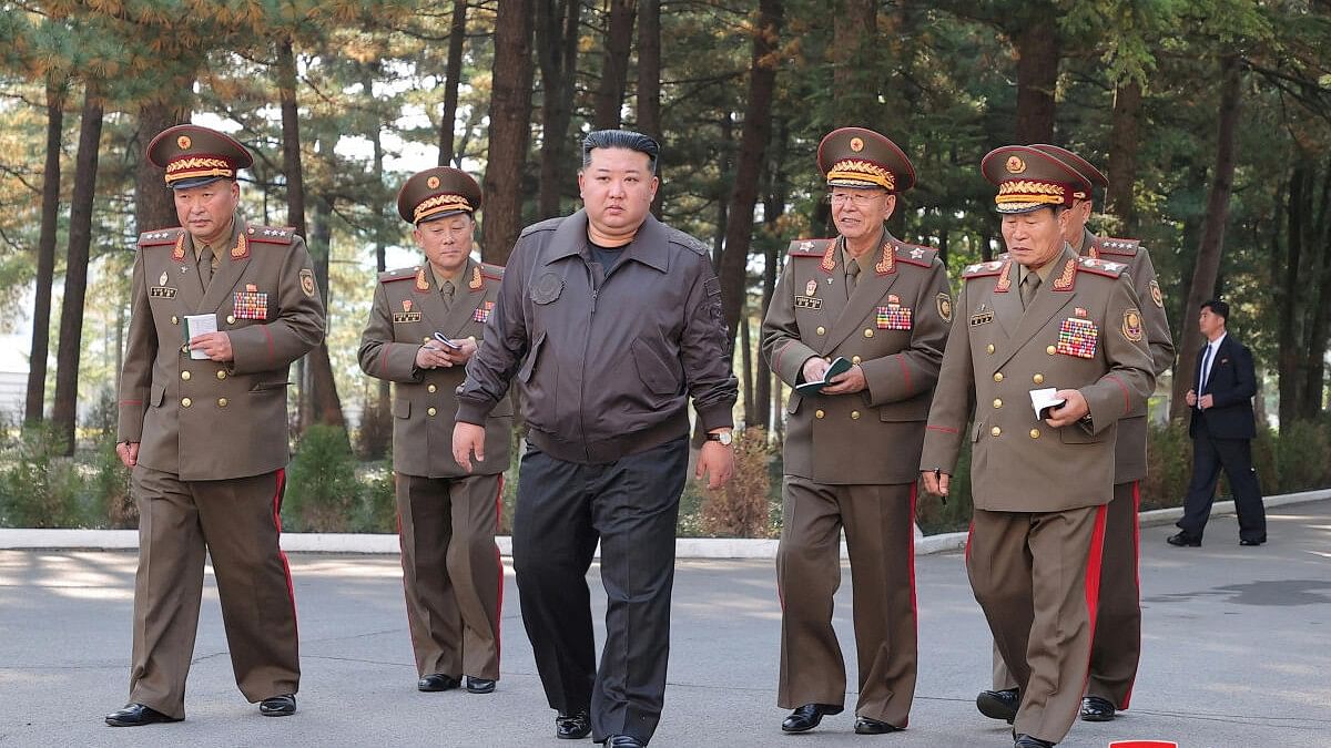 <div class="paragraphs"><p>In this photo released on October 17 by Korean Central News Agency, North Korean leader Kim Jong Un inspects the headquarters of the 2nd Corps of North Korean army.</p></div>