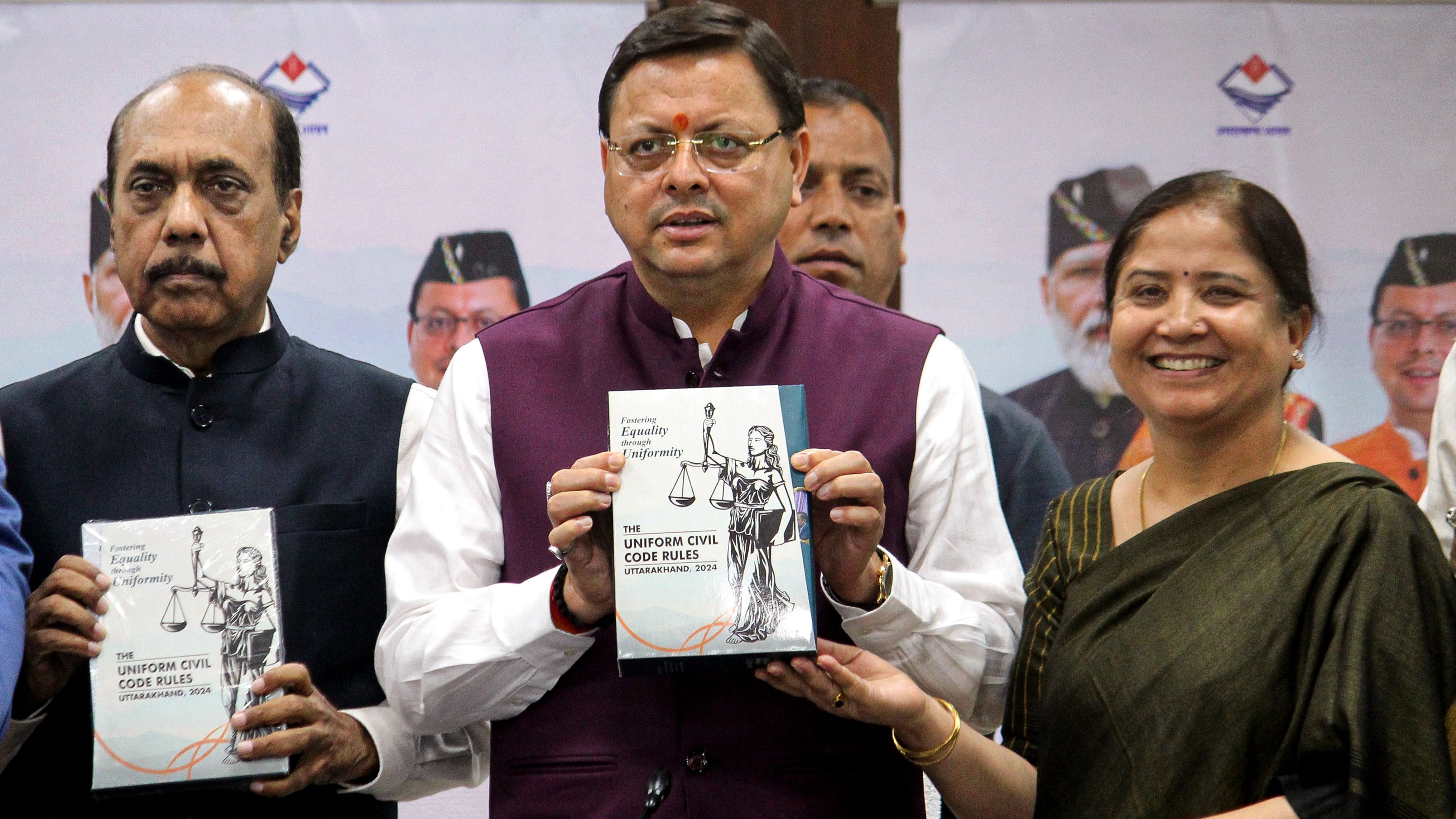 <div class="paragraphs"><p>Uttarakhand Chief Minister Pushkar Singh Dhami receives the final draft of rules and regulations prepared by a committee constituted for the implementation of the Uniform Civil Code (UCC) in the state, in Dehradun, Friday.</p></div>