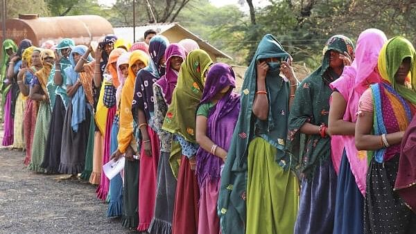 <div class="paragraphs"><p>Women wait in a long queue to cast their votes at a polling booth in Jharkhand.&nbsp;</p></div>