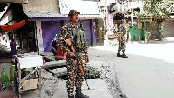 <div class="paragraphs"><p>Security personnel stand guard after a fresh violence, in Imphal. (Image for representation)</p></div>