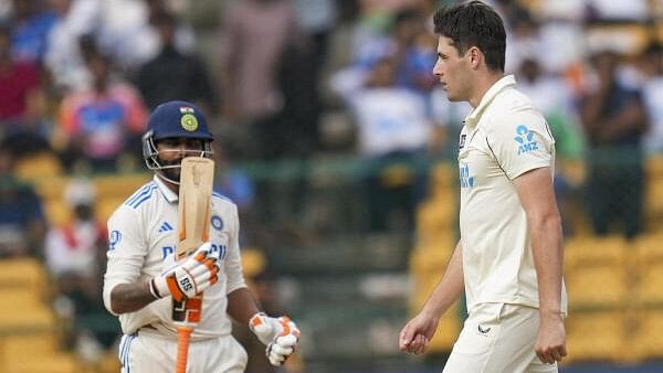 <div class="paragraphs"><p>New Zealand's bowler William O'Rourke celebrates the wicket of India’s batter Ravindra Jadeja during the fourth day of the first Test cricket match between India and New Zealand, at the M Chinnaswamy Stadium, in Bengaluru, Karnataka, Saturday, October 19, 2024. </p></div>