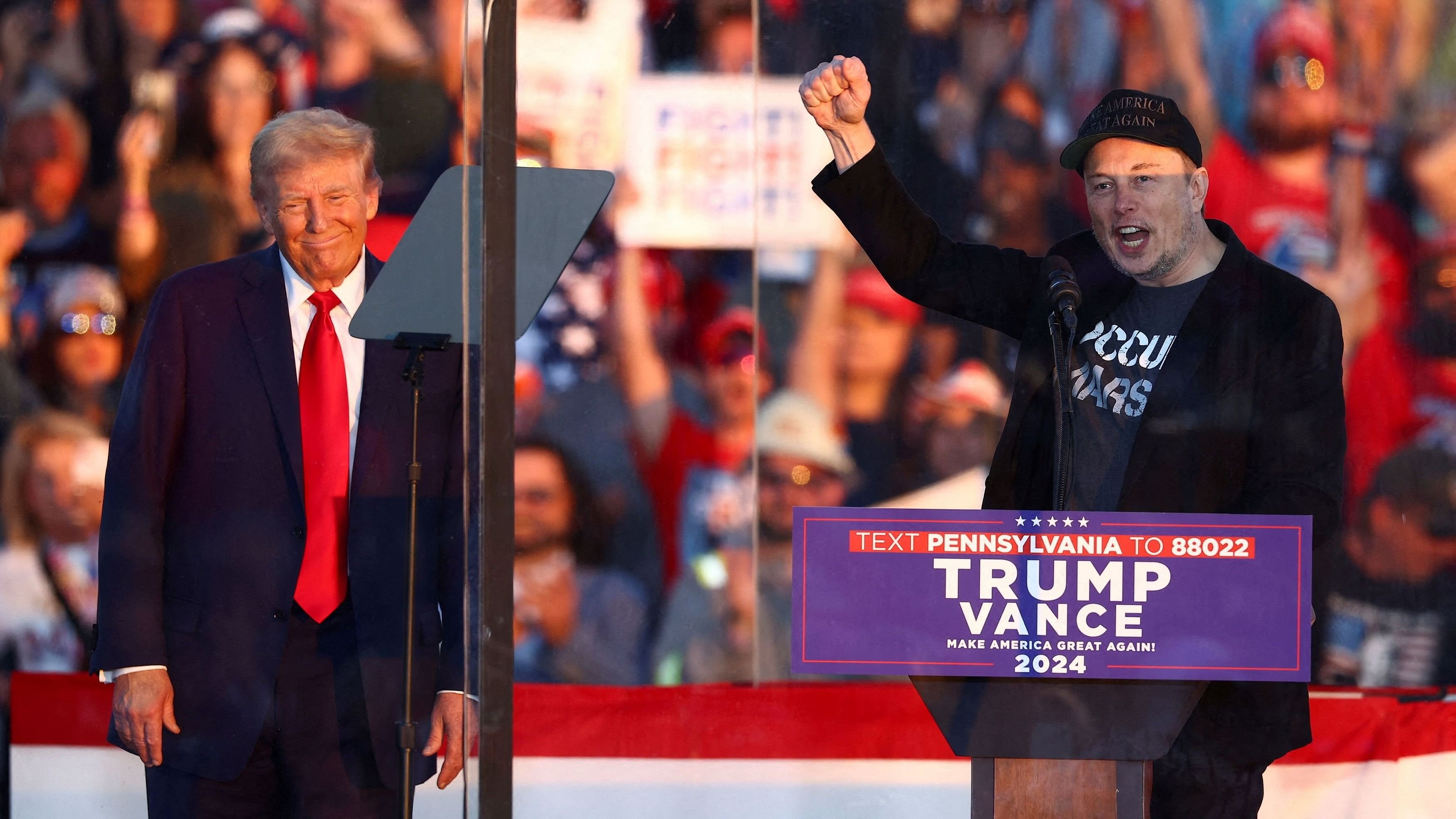 <div class="paragraphs"><p>Tesla CEO and X owner Elon Musk speaks as Republican presidential nominee and former US president Donald Trump looks on during a rally at the site of the July assassination attempt against Trump, in Butler, Pennsylvania.</p></div>