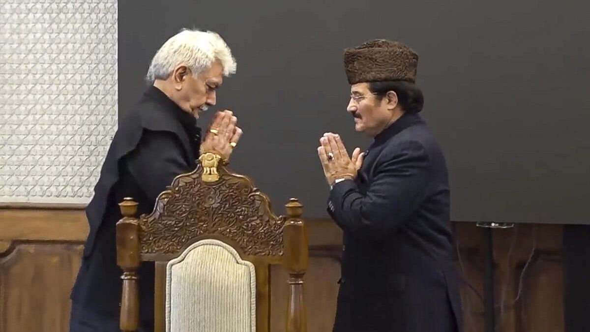 <div class="paragraphs"><p>Jammu and Kashmir Lieutenant Governor Manoj Sinha greets the union territory's newly appointed Pro-Tem Speaker Mubarak Gul after the latter's oath ceremony at Raj Bhawan, in Srinagar.</p></div>