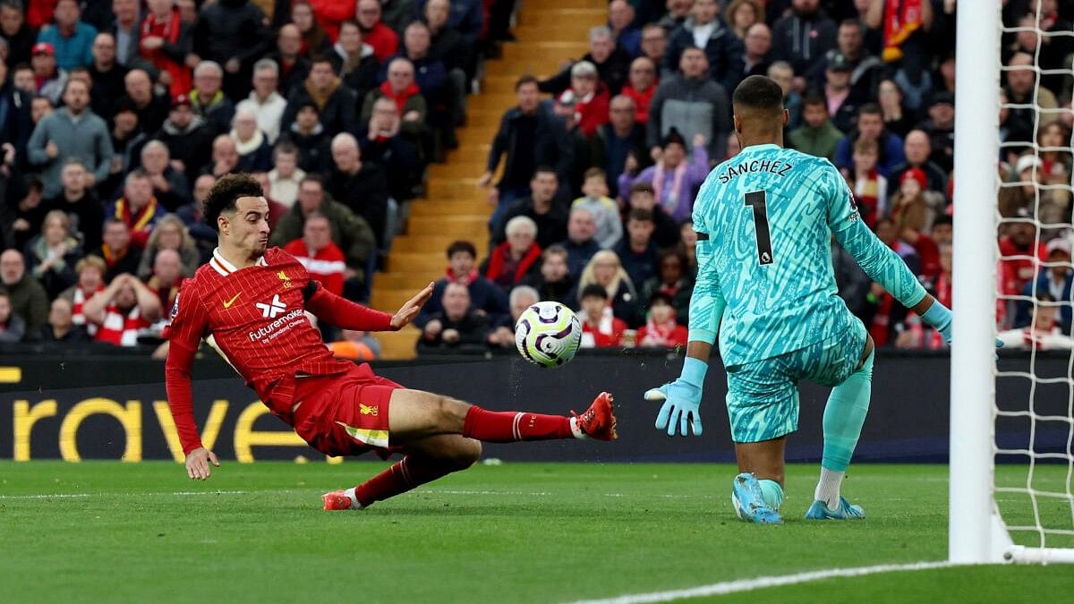 <div class="paragraphs"><p>Liverpool's Curtis Jones scores their second goal.</p></div>