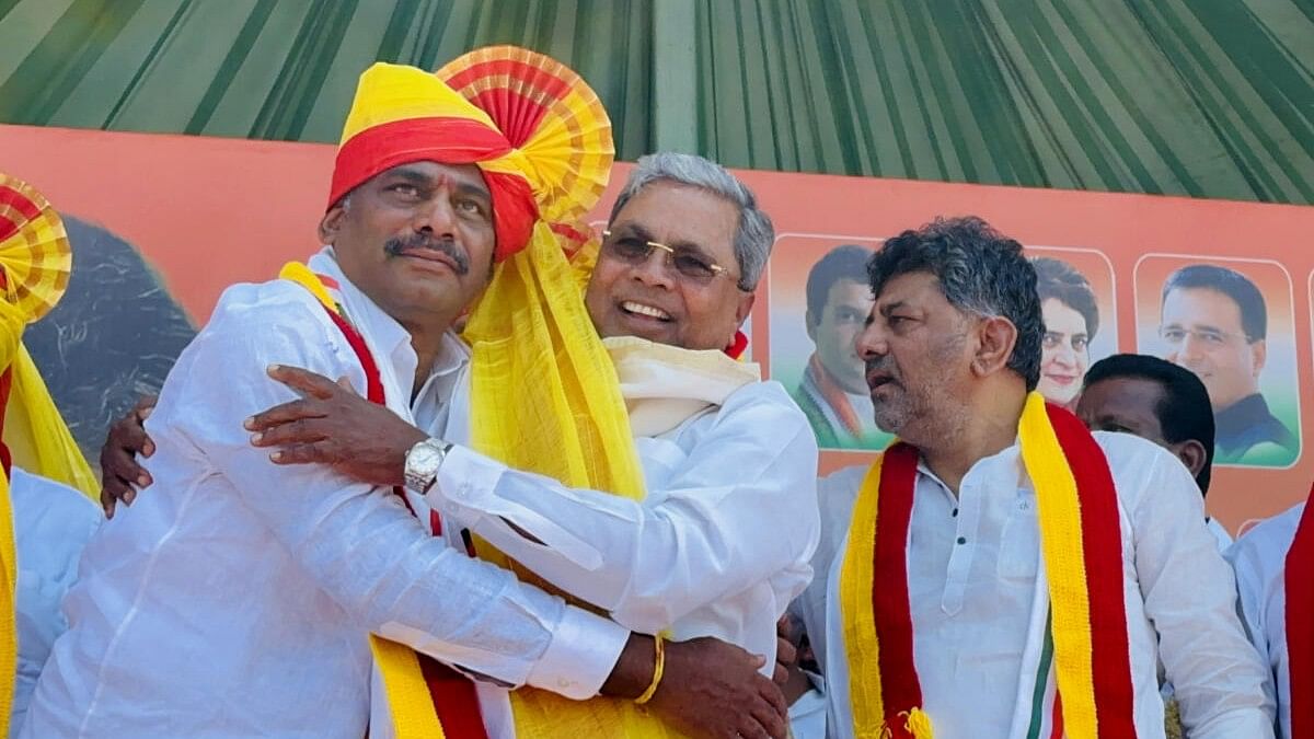 <div class="paragraphs"><p>D K Suresh with Karnataka Chief Minister Siddaramaiah and Deputy CM D K Shivakumar.</p></div>