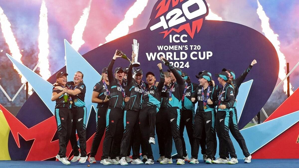 <div class="paragraphs"><p>New Zealand's Sophie Devine lifts the trophy as she celebrates with teammates after winning the Women's Cricket T20 World Cup.</p></div>