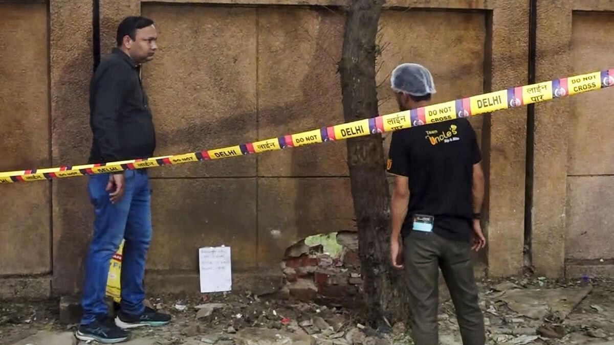 <div class="paragraphs"><p>Forensic team collects samples from the site where a blast occured, near a CRPF school at Prashant Vihar, in Rohini area of New Delhi</p></div>