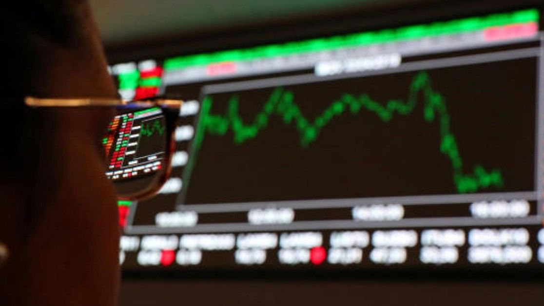 <div class="paragraphs"><p>A woman looks at an electronic board showing a graph of recent fluctuations of market indexes. Representative Image. </p></div>