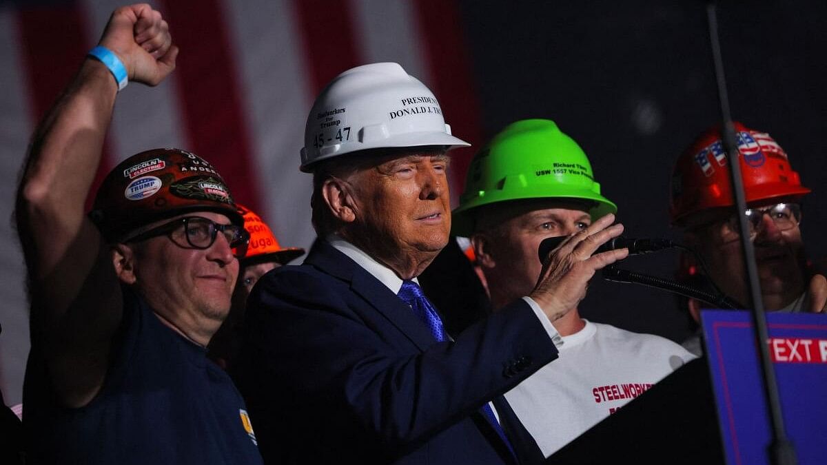 <div class="paragraphs"><p>Endorsed by steel workers onstage, Republican presidential nominee and former US President Donald Trump wears a hard hat during his Make America Great Again Rally in Latrobe, Pennsylvania, US.</p></div>