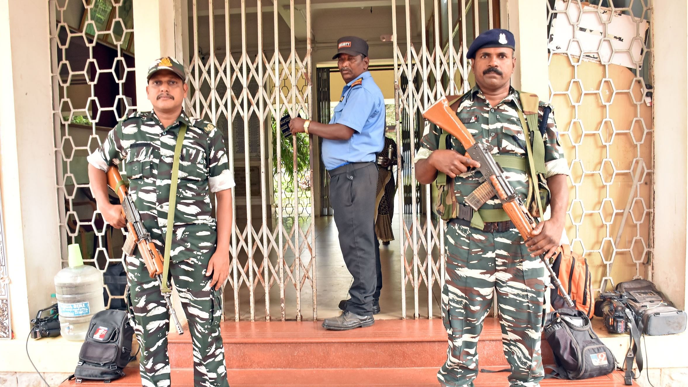 <div class="paragraphs"><p>Security forces stand guard outside the MUDA office amid ED raids, Mysuru, October 19, 2024.</p></div>