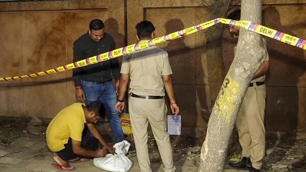 <div class="paragraphs"><p>Forensic team collects samples from the site where a blast occured, near a CRPF school at Prashant Vihar, in Rohini area of New Delhi</p></div>