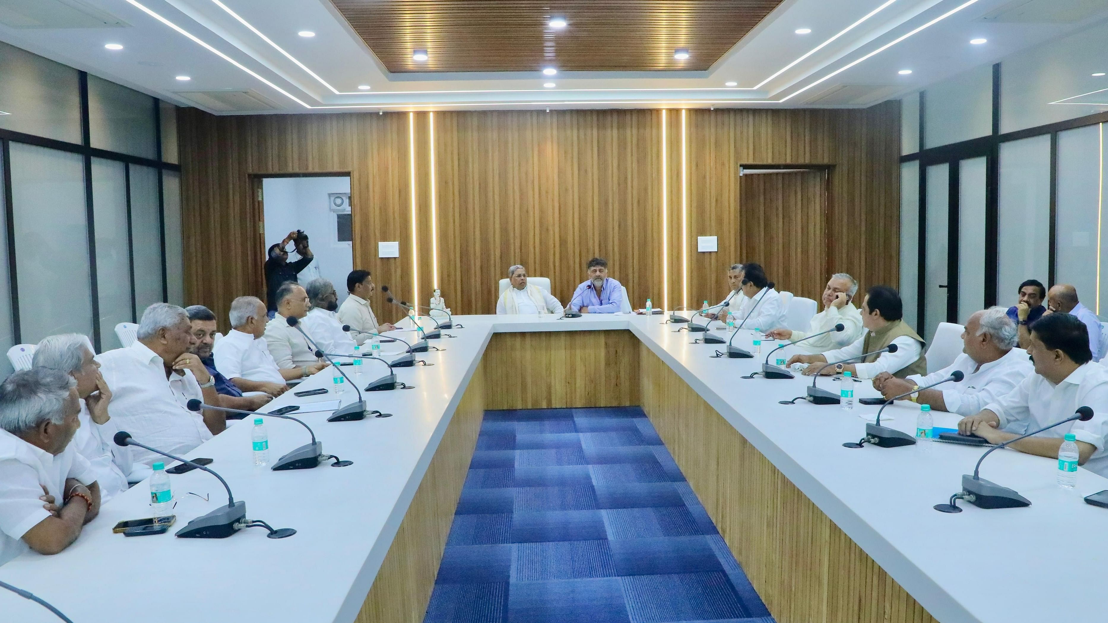 CM Siddaramaiah, his deputy D K Shivakumar and other ministers during a meeting to discuss about the upcoming bypolls on Sunday.