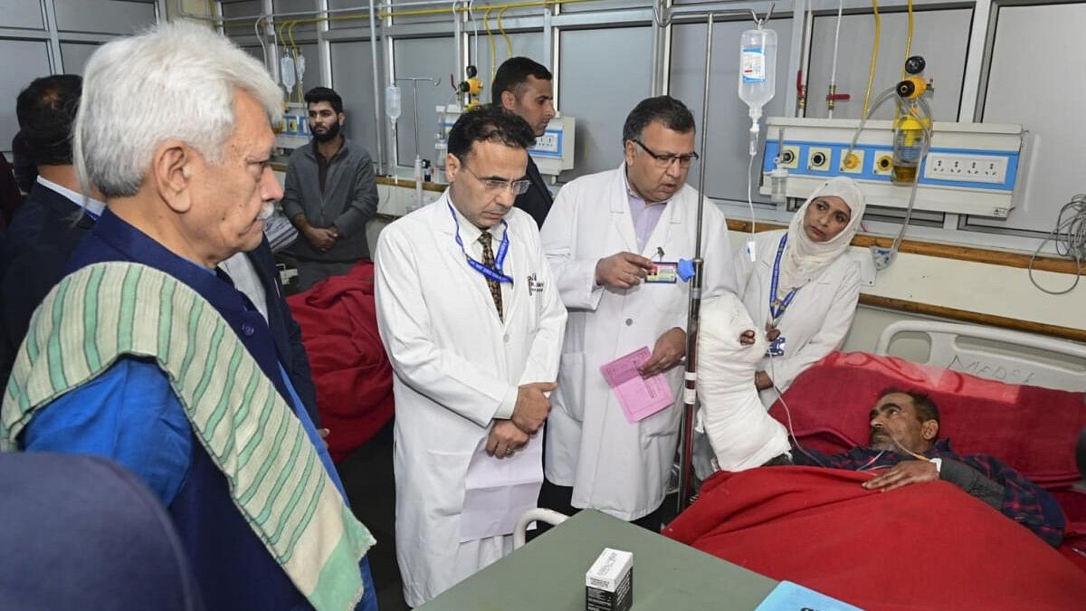 <div class="paragraphs"><p>Manoj Sinha visits a labourer who suffered injuries in a terrorist attack in Ganderbal.</p></div>