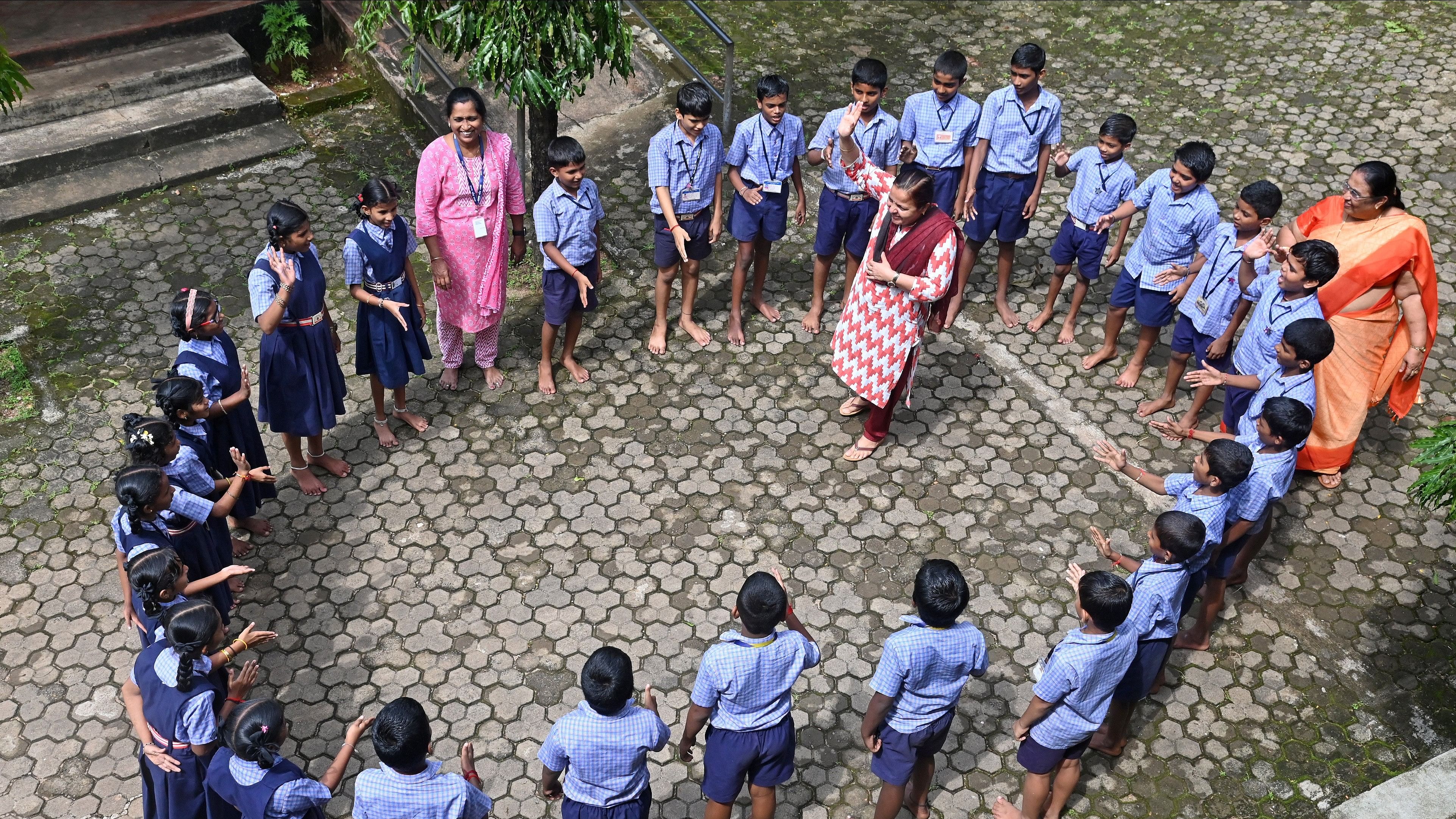 <div class="paragraphs"><p>Teachers collaborate to play with children in Mangaluru. </p></div>