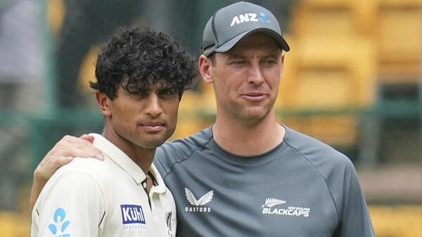 <div class="paragraphs"><p>New Zealand's Rachin Ravindra and Matt Henry during the presentation ceremony after their team won the first test cricket match against India</p></div>