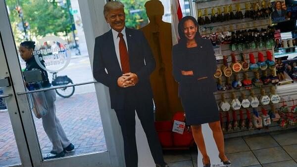 <div class="paragraphs"><p>Cutouts of Republican presidential nominee and former US President Donald Trump and Democratic presidential nominee and US Vice President Kamala Harris are displayed at a store where souvenirs of the US presidential elections are sold, in Washington, US October 16, 2024.</p></div>