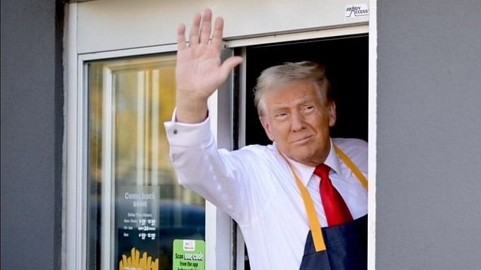 <div class="paragraphs"><p>Trump, slinging fries and smearing Harris, takes turn behind a McDonald's counter</p></div>