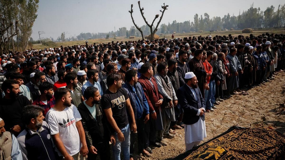 <div class="paragraphs"><p>Mourners pray during the funeral of Shahnawaz Dar, a doctor who was killed in a suspected militant attack at a tunnel construction site in Ganderbal's Gaganeer, in Budgam.</p></div>