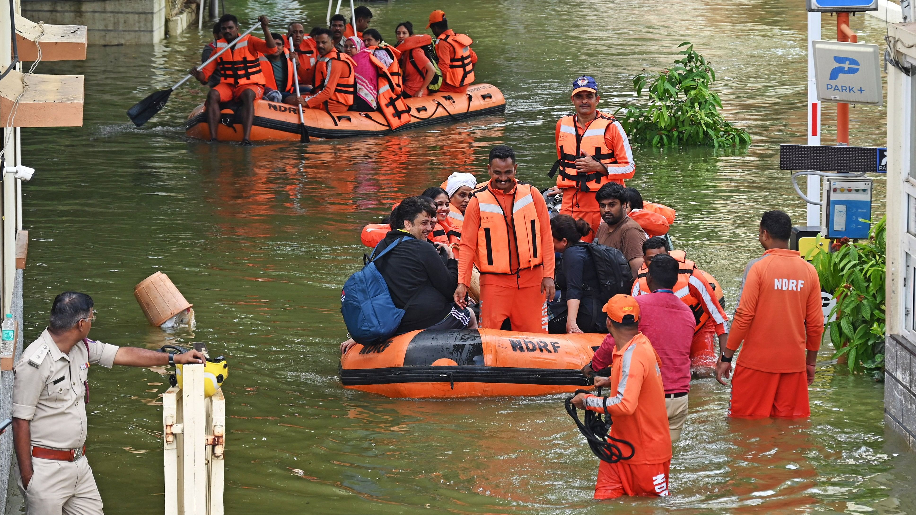 <div class="paragraphs"><p>The NDRF team rescues residents from the Kendriya Vihar apartment complex on inflatable boats in Yelahanka, Bengaluru, on Tuesday. </p></div>