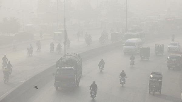 <div class="paragraphs"><p>Vehicles move amid dense smog in Lahore, Pakistan.</p></div>