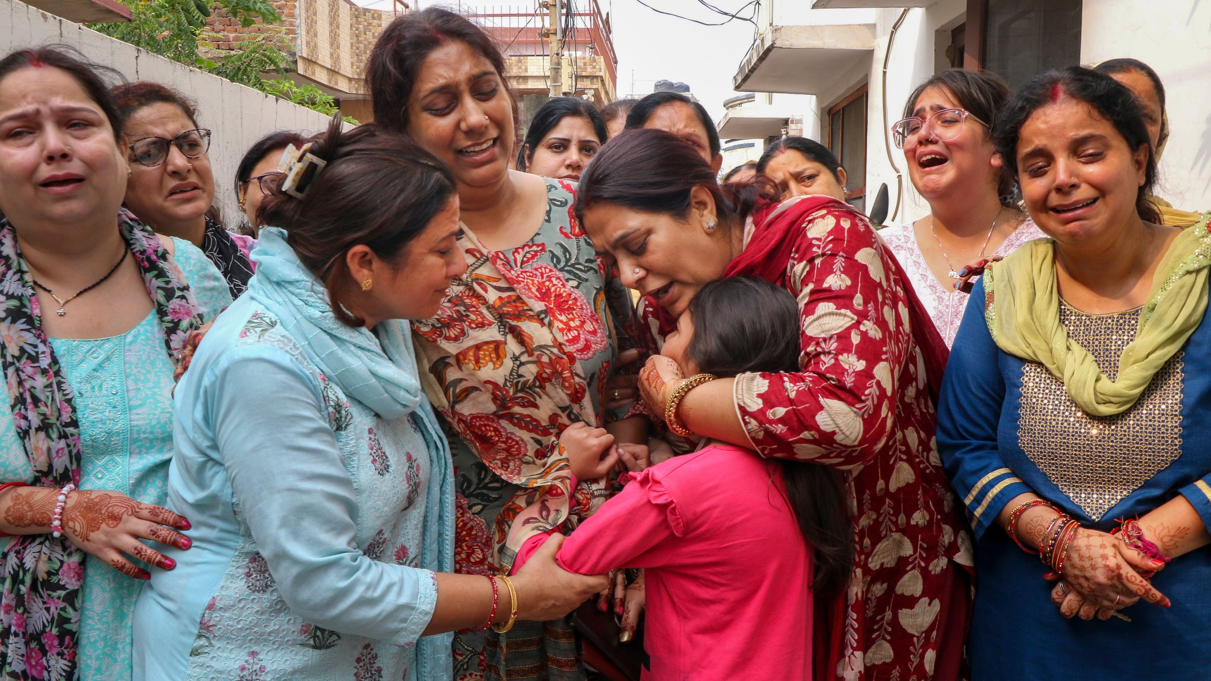 <div class="paragraphs"><p>Jammu: Relatives of Shashi Bhushan Abrol, who was killed in a terrorist attack in J&amp;K's Ganderbal on Sunday, mourn during his funeral, in Jammu, Tuesday, Oct. 22, 2024. </p></div>