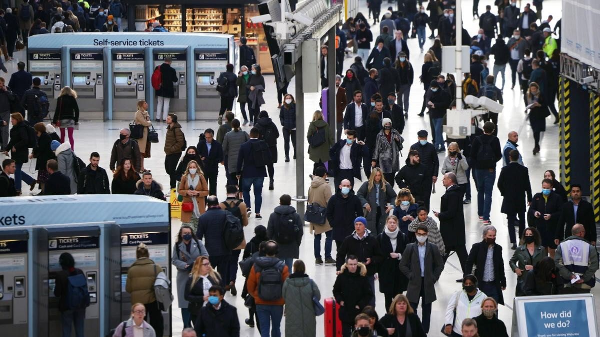 <div class="paragraphs"><p>People walk through Waterloo station during morning rush hour in London.</p><p></p></div>