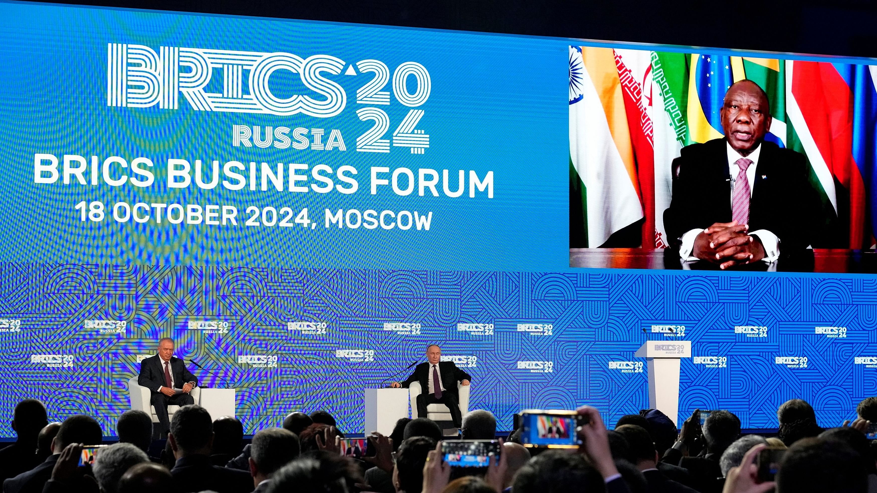 <div class="paragraphs"><p>Russian President Vladimir Putin listens to South African President Cyril Ramaphosa speaking via a video link during the BRICS Business Forum in Moscow.</p></div>