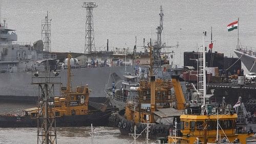 <div class="paragraphs"><p>Ships and a submarine belonging to the Indian Navy are seen docked at the naval dockyard in Mumbai </p></div>