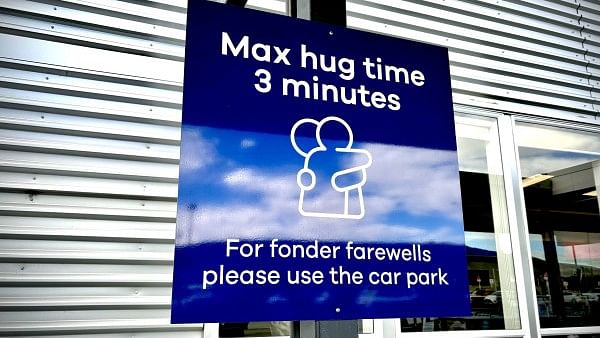 <div class="paragraphs"><p>The sign in Dunedin Airport that says 'Max hug time 3 minutes'.</p></div>