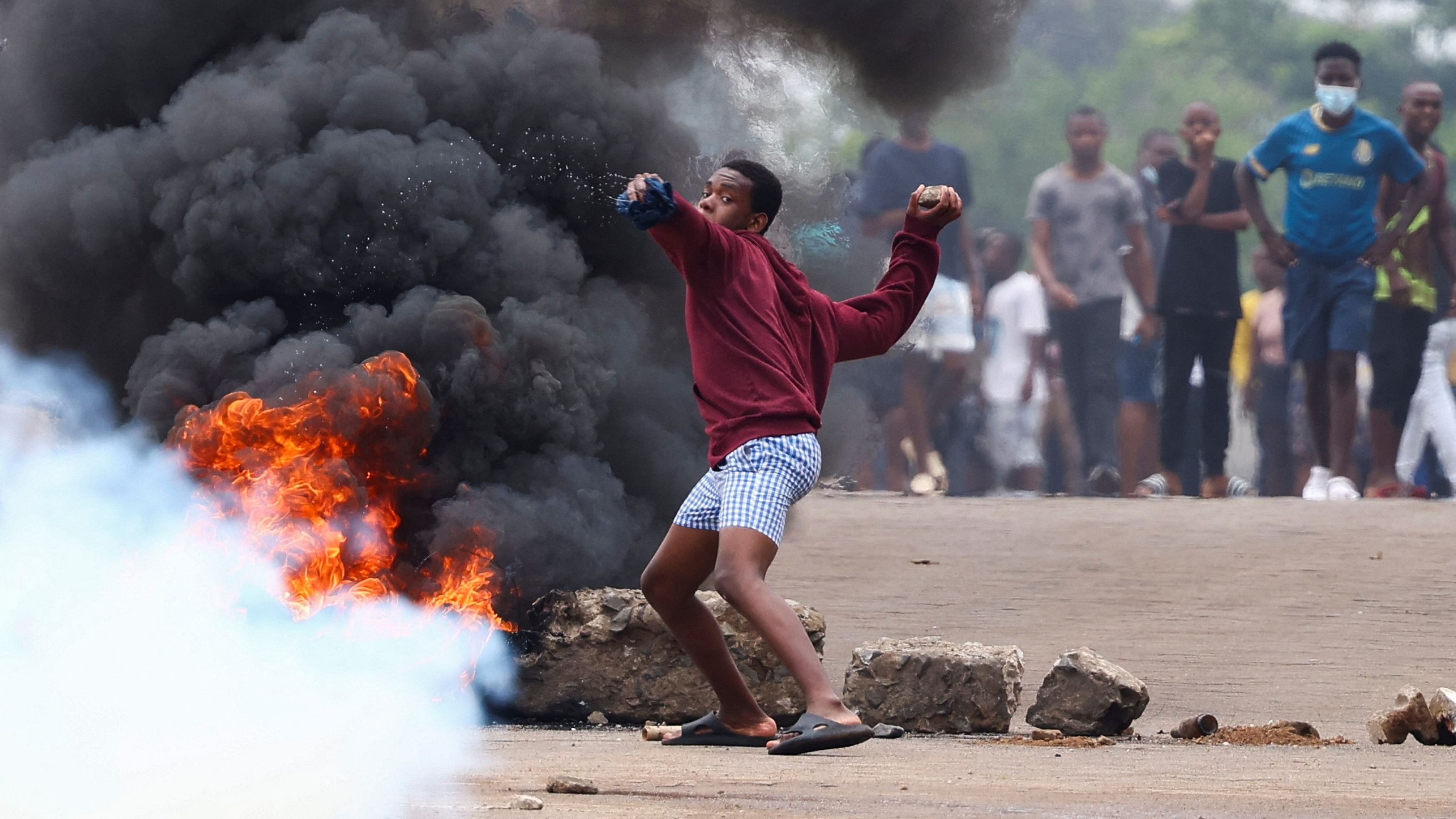 <div class="paragraphs"><p>A protester throws a stone during a nationwide strike called by Mozambique presidential candidate Venancio Mondlane to protest the provisional results of an October 9 election, in Maputo, Mozambique, October 21, 2024</p></div>