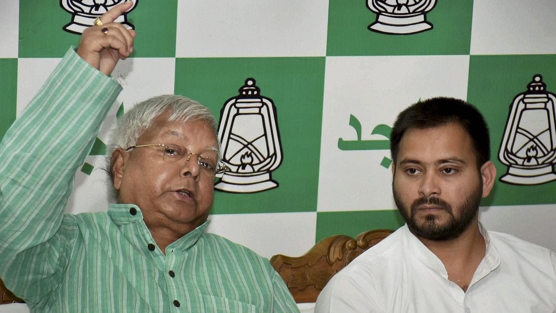 <div class="paragraphs"><p>RJD supremo Lalu Prasad addressing a press conference with Grand Alliance CM candidate Tejashwi Yadav. </p></div>