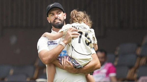 <div class="paragraphs"><p>New Zealand's Daryl Mitchell during the presentation ceremony after his team won the first test cricket match against India, at the M Chinnaswamy Stadium, in Bengaluru, Sunday, Oct. 20, 2024. </p></div>