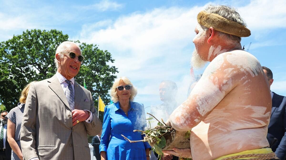 <div class="paragraphs"><p>Britain's King Charles and Queen Camilla take part in a smoking ceremony as they attend a community barbecue during a visit to Parramatta Park in Sydney, Australia</p></div>