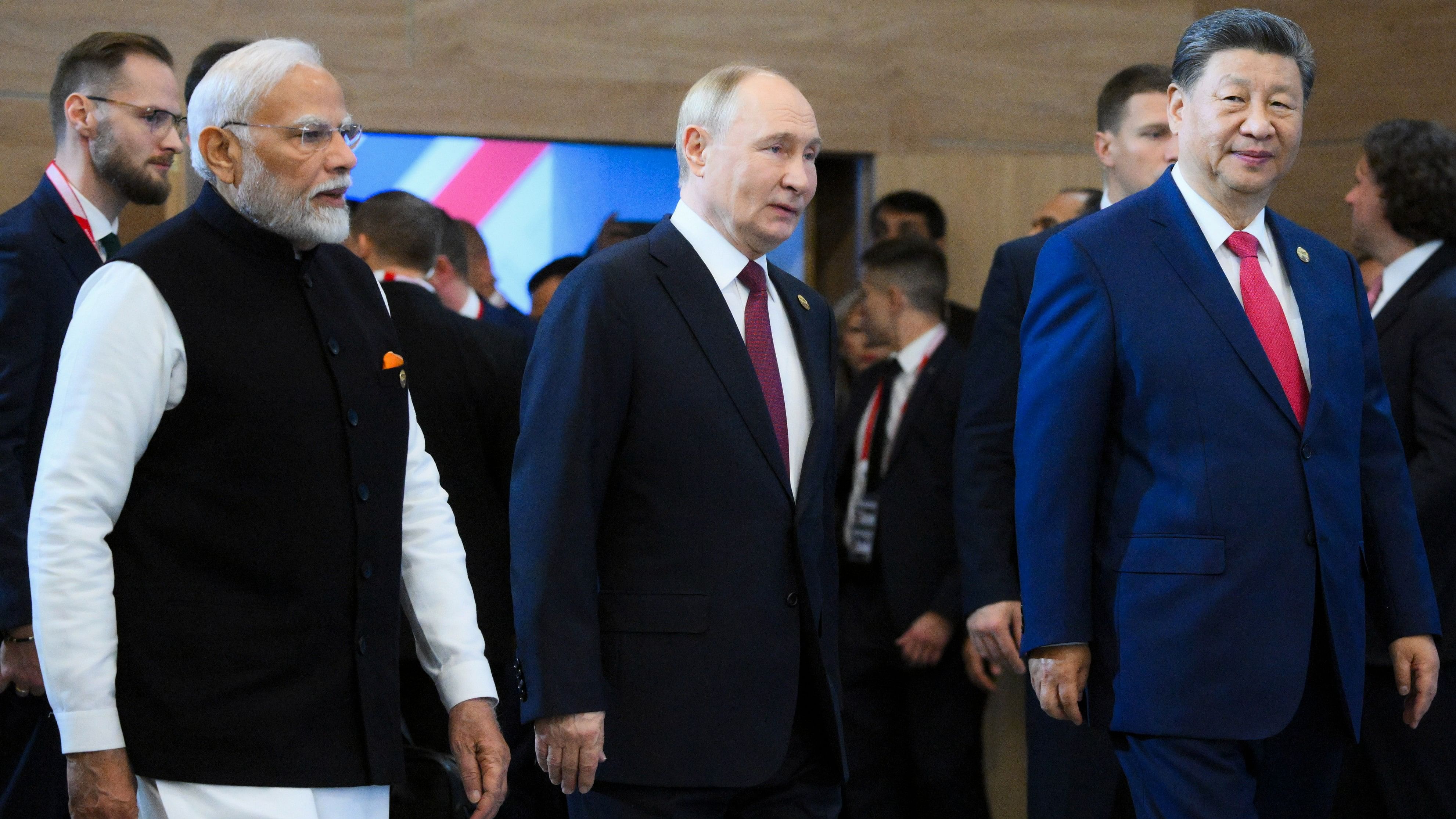 <div class="paragraphs"><p>Prime Minister Narendra Modi with Russia's President Vladimir Putin and China's President Xi Jinping during the 16th BRICS Summit, in Kazan, Russia, Wednesday.</p></div>