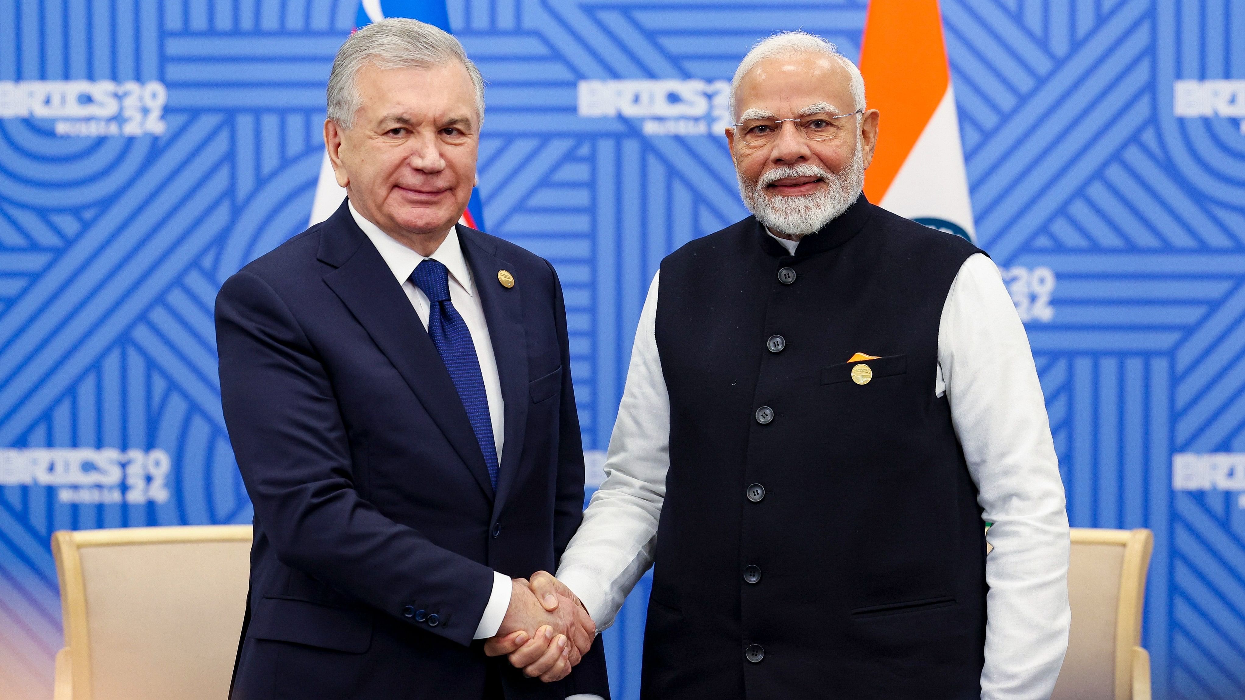 <div class="paragraphs"><p>Prime Minister Narendra Modi meets Uzbekistan President Shavkat Mirziyoyev on the sidelines of the 16th BRICS Summit, in Kazan, Russia, Wednesday, Oct 23, 2024.</p></div>