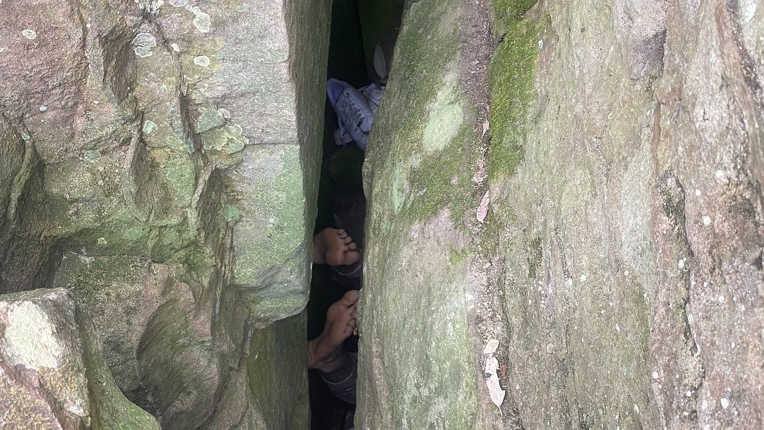 <div class="paragraphs"><p>A view of the woman stuck upside down between the boulders.</p></div>