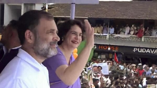 <div class="paragraphs"><p>Congress leader and Leader of Opposition in Lok Sabha Rahul Gandhi with his sister and party leader Priyanka Gandhi Vadra during a road show after she filed her nomination papers for Wayanad Lok Sabha constituency by-polls, in Wayanad district, Kerala.</p></div>