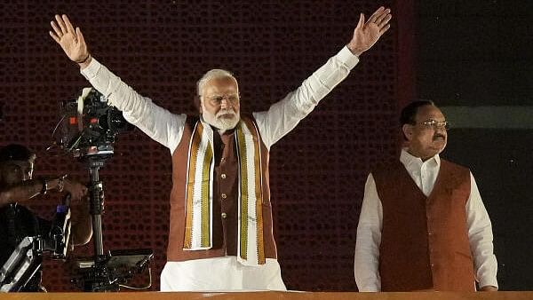 <div class="paragraphs"><p>Prime Minister Narendra Modi and Union Minister and BJP National President JP Nadda greet the gathering at the party headquarters after the declaration of results for the Haryana.</p></div>