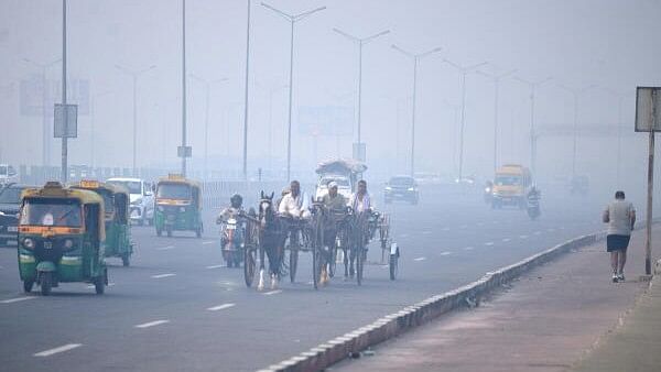 <div class="paragraphs"><p>Commuters on a road amid smog, in New Delhi.</p></div>